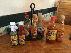 Hot Sauce on Tables? Yes.  Si. Oui. Prego.